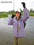 The first fish on a fly of 2011 for either of us, and she caught it while I was still rigging up my rod. From Nome Creek in Alaska.