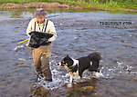 Inspecting the net with my intrepid sidekick. From Nome Creek in Alaska.