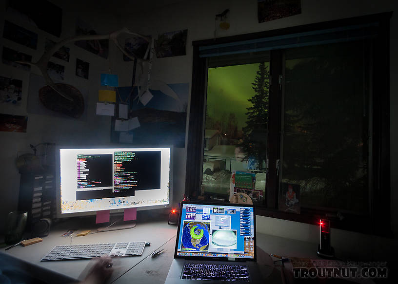 I liked the lighting at my workstation last night.  Aurora forecasts on my laptop, aurora out the window, and C code for multidimensional nonlinear minimization on my desktop. From Fairbanks in Alaska.