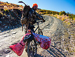 Final load packed up. I strapped the hind quarters off either side of my bike's rear tire rack, loaded the burger/rib bag and antlers in my pack, and had an easy ride out to the car without Lena having to carry anything or get messy caribou on her gear. From Clearwater Mountains in Alaska.