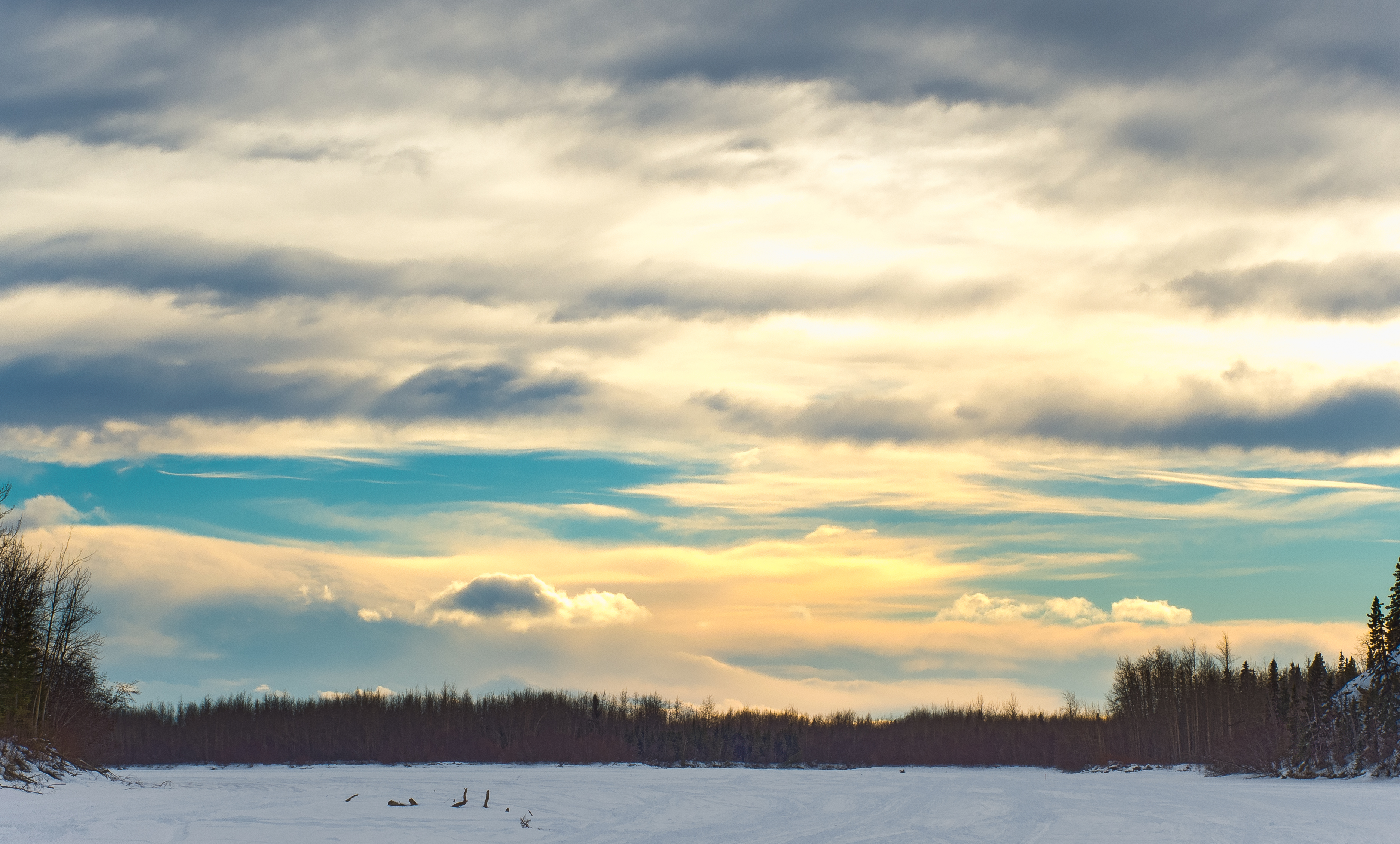 This was a typical late-winter sunset over the frozen Tanana River, a popular highway for mushers and skiiers outside of Fairbanks until the ice becomes unnavigable due to overflow sometime in April. From the Tanana River in Alaska.