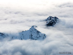 Small peaks poking through the clouds From Denali National Park in Alaska.
