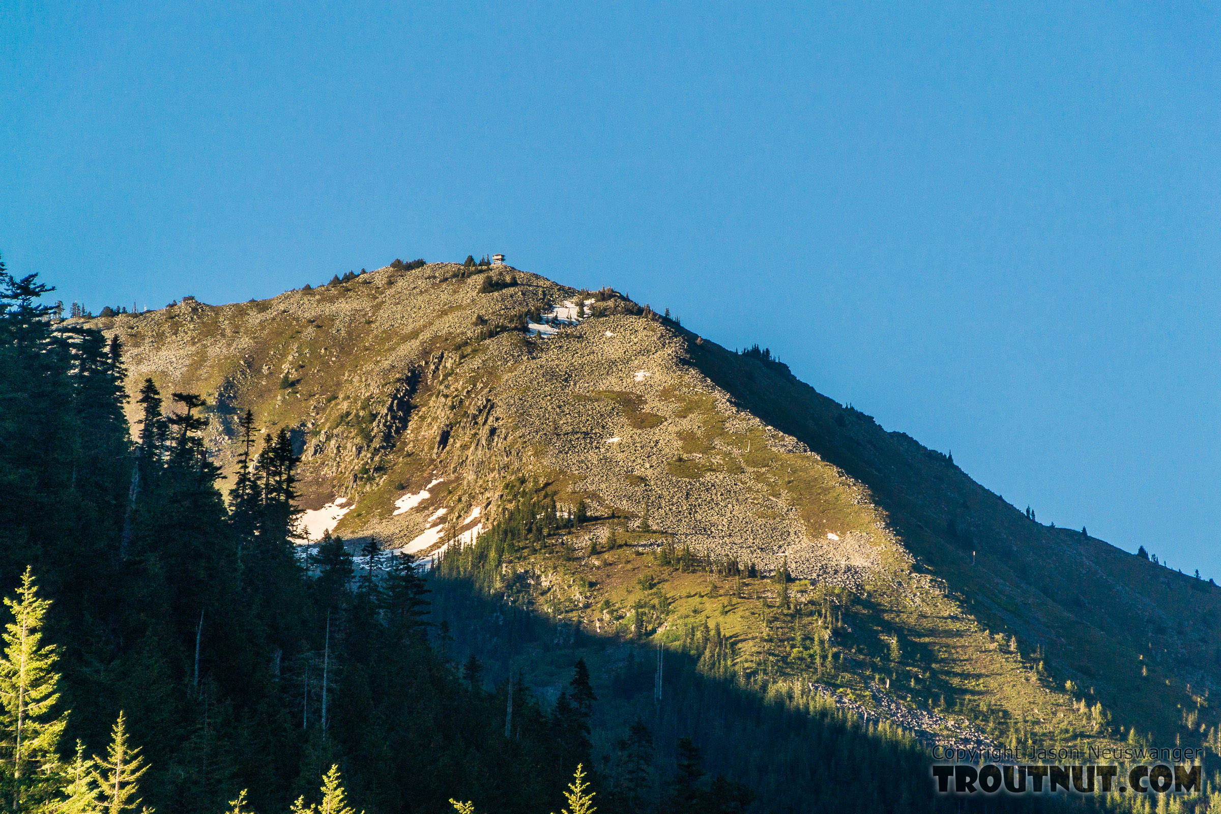Granite Mountain with Granite Mountain Lookout tower on top From the South Fork Snoqualmie River in Washington.