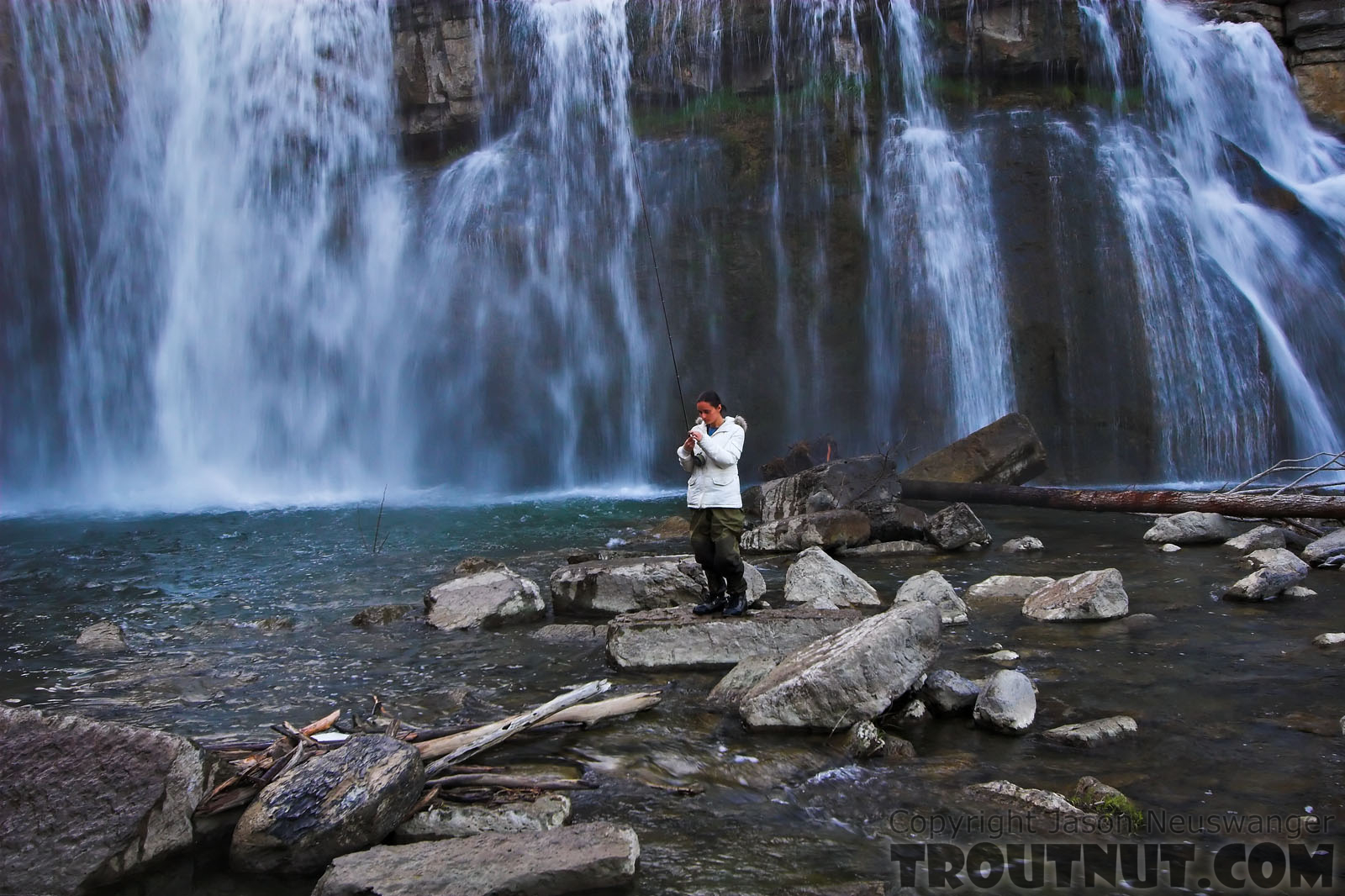 My girlfriend prepares to cast into a deep waterfall pool. From Salmon Creek, Ludlowville Falls in New York.