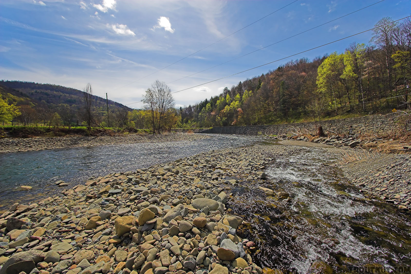 A swift tributary of a Catskill trout stream slides down its own high delta of boulders and cobble. From the Beaverkill River, Horton Bridge Pool in New York.