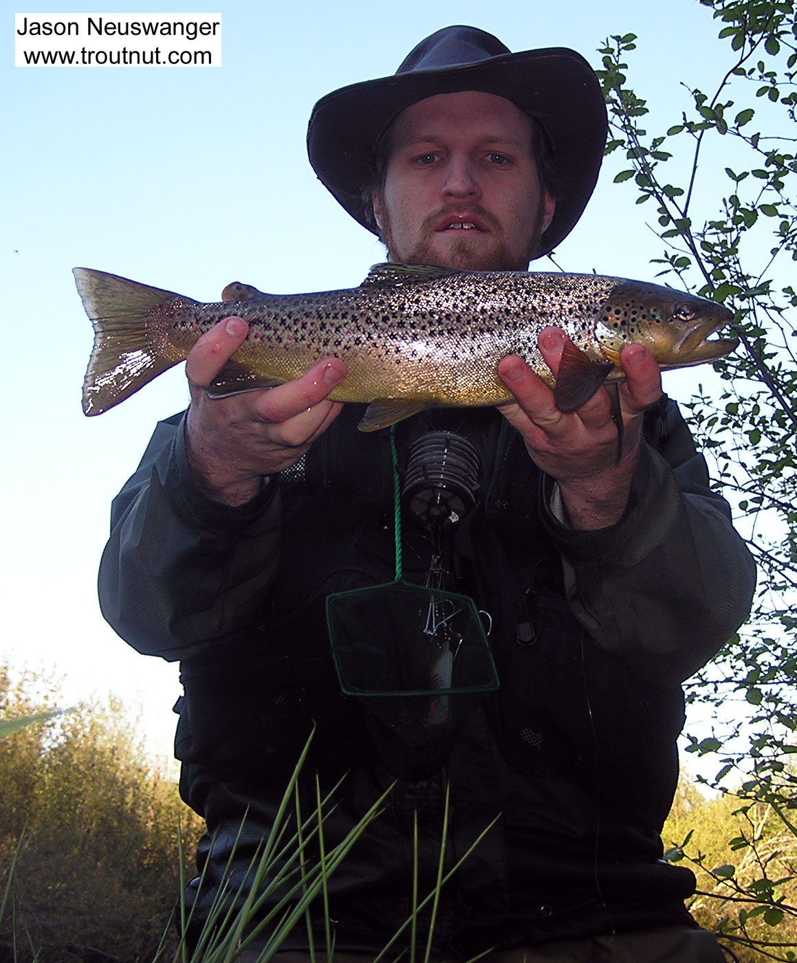 Here I am soaking wet holding up a hard-earned 17 inch brown trout. An hour or so before I caught her, I attempted a treacherous crossing over loose gravel, and the river was running high.  I found myself treadmilling on my tiptoes to maintain my footing as the gravel slipped beneath me, and I was swept off downstream and swam to shore with a few gallons of 55 degree water in my waders. Being me, I kept fishing. From the Bois Brule River in Wisconsin.