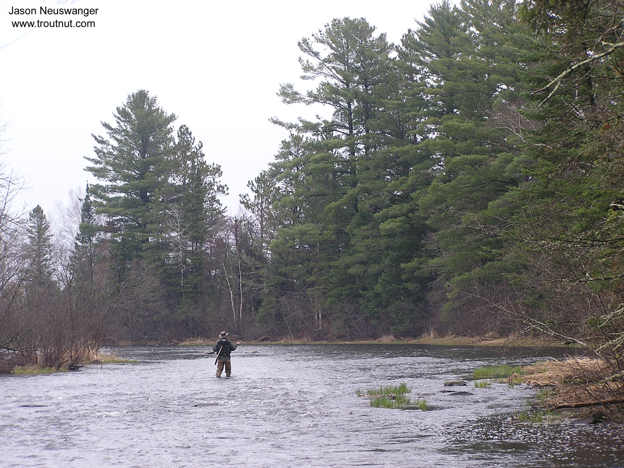 I'm in this picture casing into the riffle above one of my favorite pools.  The fishing was fine, but the catching wasn't so hot.  I got one strike on my carefully tied nymphs and two on my cheap foam strike indicator. From the Namekagon River in Wisconsin.