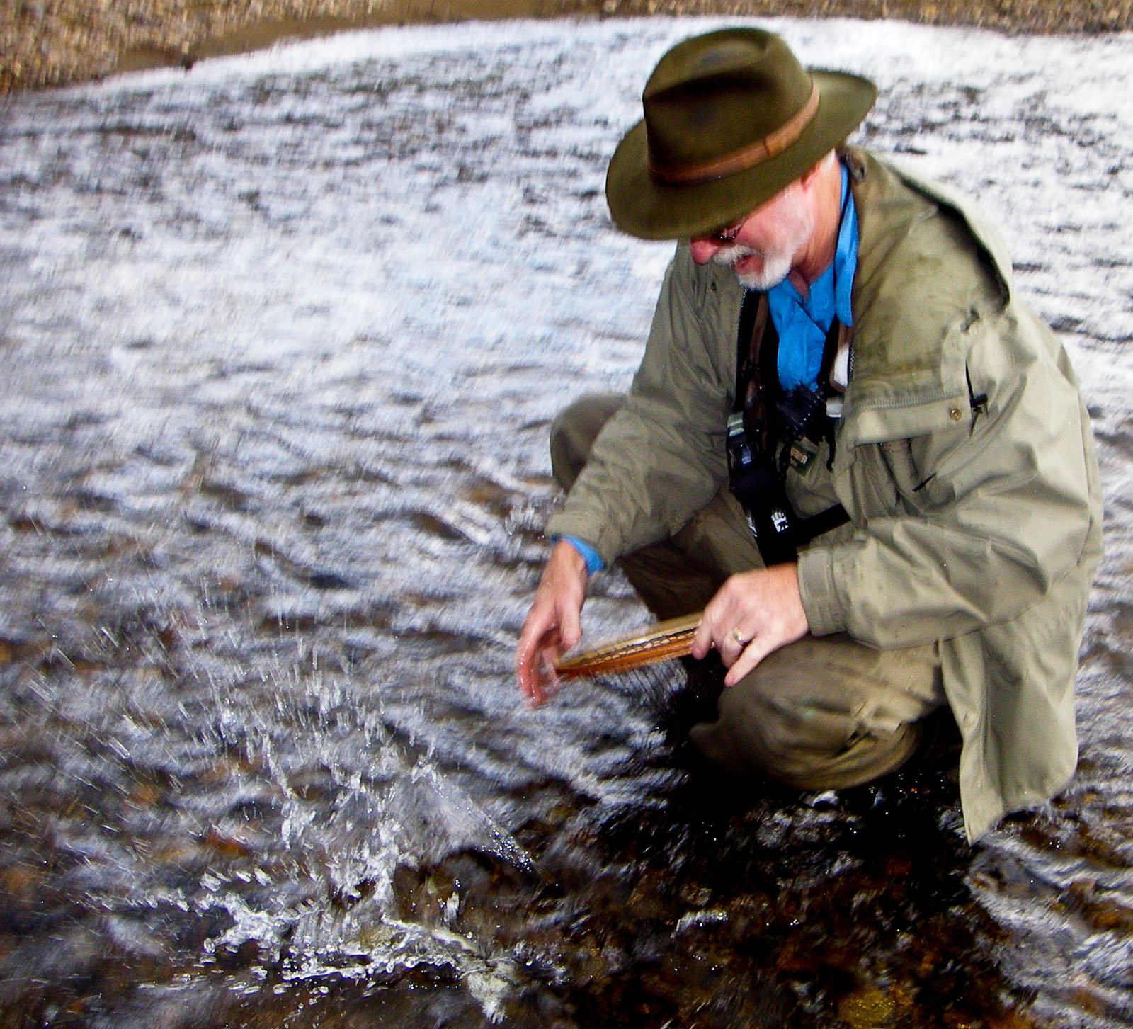 Another entry into my "dad dropping a fish" series.  Here he's dropping his first arctic grayling back in the drink.  It was still on the hook, so we got a better picture shortly. From the Chatanika River in Alaska.