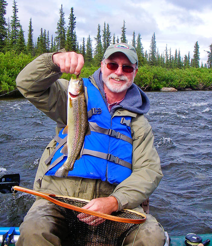 This is my dad's first wild Alaskan rainbow trout. From the Gulkana River in Alaska.