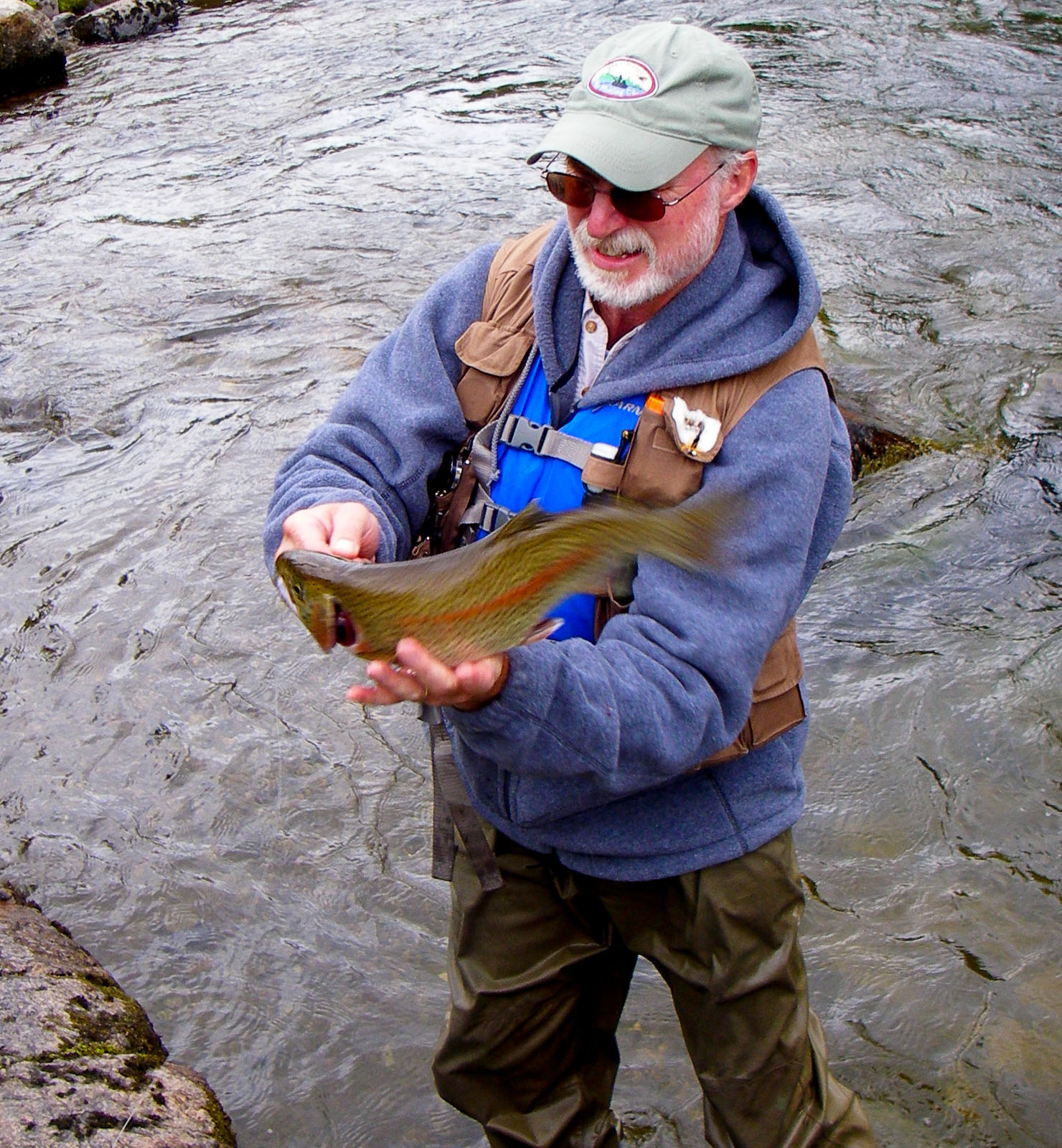 Here my dad drops his largest resident rainbow ever, after a spectacular fight.  It's a good 18 inches.  From the Gulkana River in Alaska.