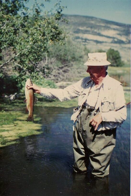 My Dad with a colorful rainbow - We released all our fish and this was long before C&R handling techniques 