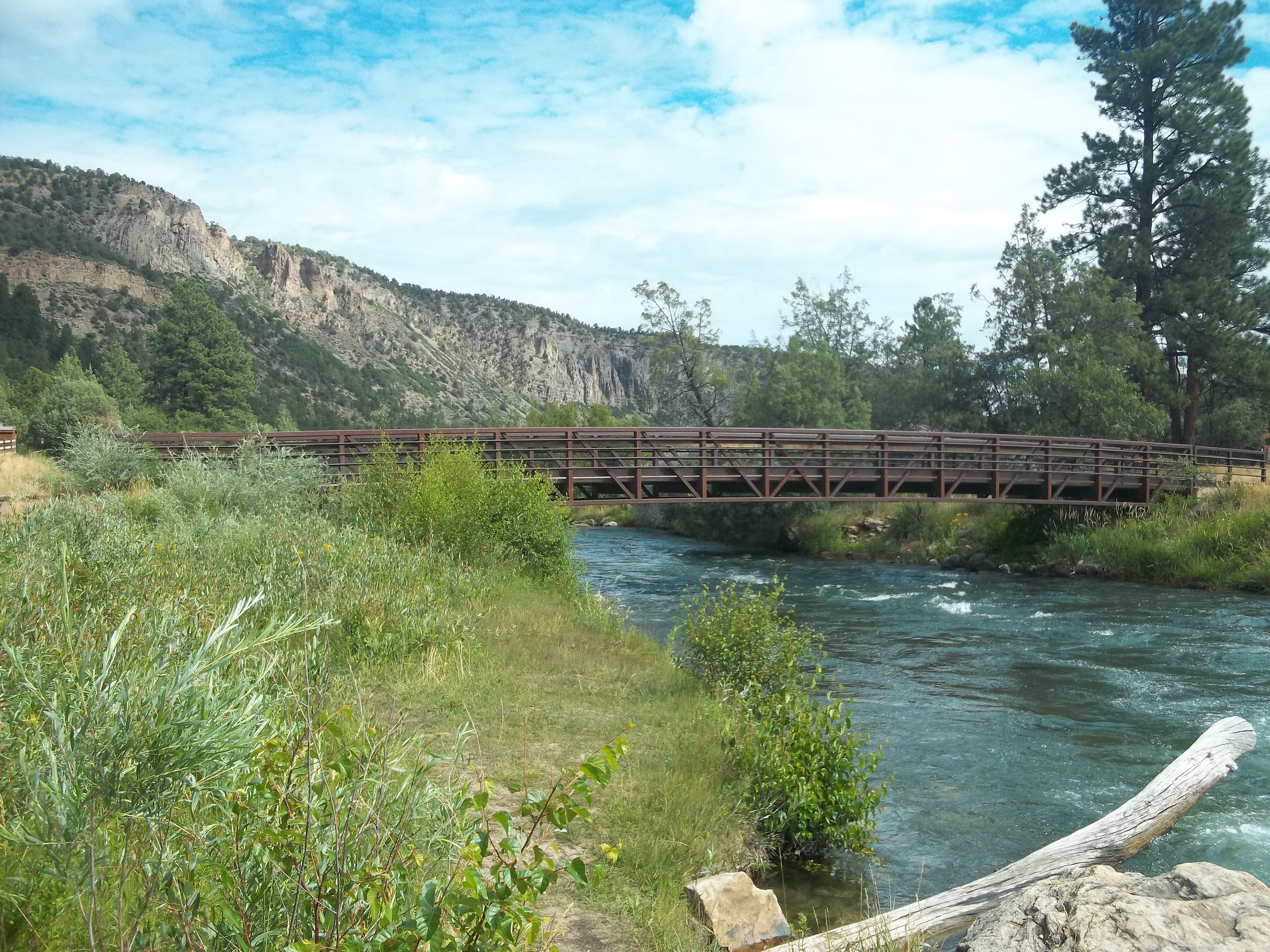 The Uncompahgre tailwaters near camp (a small footbridge allows anglers to fish both sides of the stream without attempting a difficult crossing.)