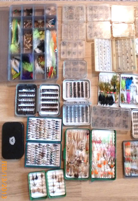 The other one third of my fly boxes - the long green box is all shrimp & crab patterns for bonefish and permit. The large opague gray box on the upper left is big striper and shark flies as well as barracuda flies and big poppers and I can see about a dozen grasshoppers too.