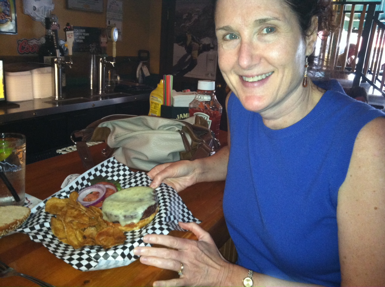 Lisa and her Bison Burger in Red Lodge Montana