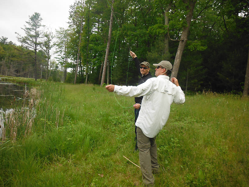 Joe receiving casting instruction from Todd at the bass pond (Clark's Marsh)