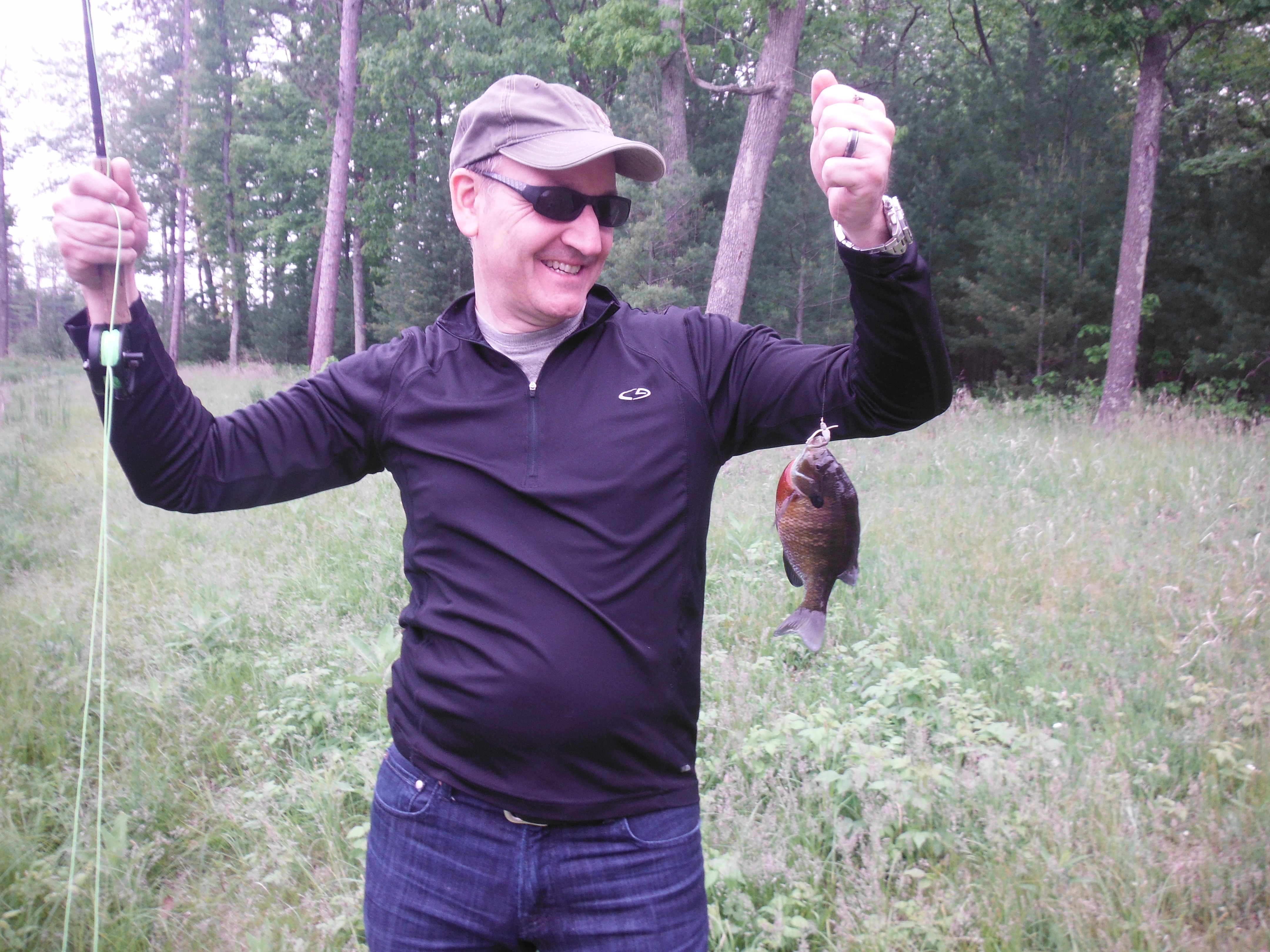 SUCCESS!!!  Joe's first ever fish on a fly rod, first time he's ever cast a fly!