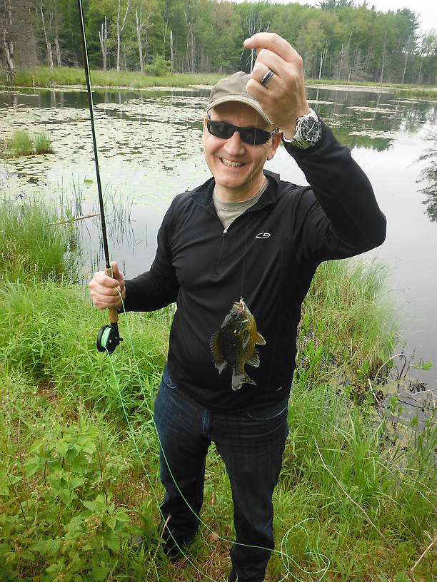A nice fat sunfish, possibly a pumpkinseed/green hybrid - notice the smile as well!